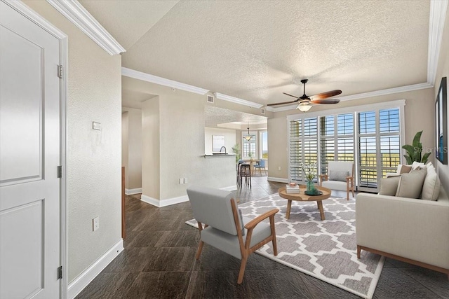 living room with a textured ceiling, ceiling fan, and crown molding