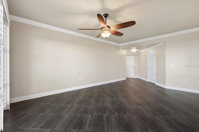 empty room featuring ceiling fan and ornamental molding