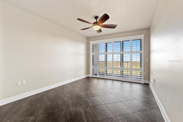 unfurnished room with a textured ceiling and ceiling fan