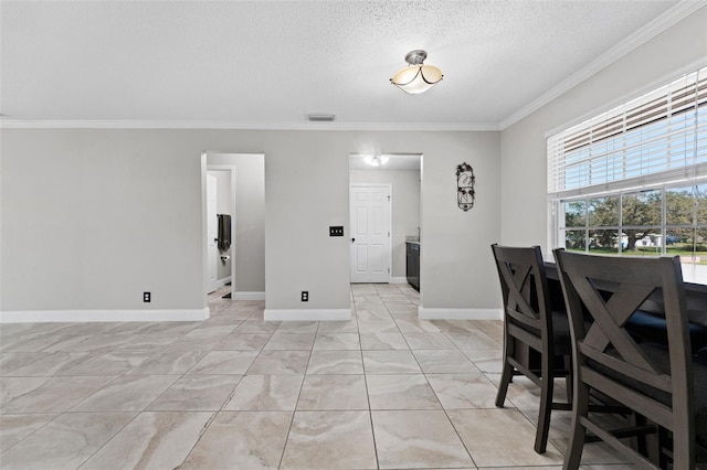 dining room with a textured ceiling and crown molding