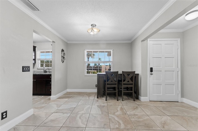 home office featuring sink, a textured ceiling, and ornamental molding