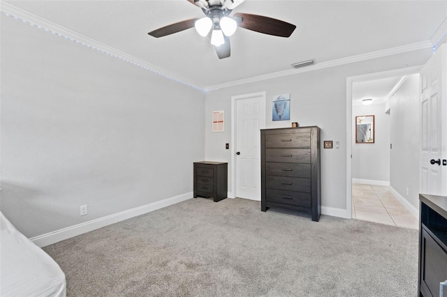 carpeted bedroom with ceiling fan and ornamental molding