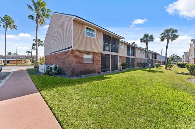 view of home's community with a yard