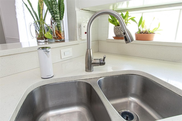 14324 Moon Flower Dr, Tampa, FL 33626 - room details featuring light stone counters and a sink