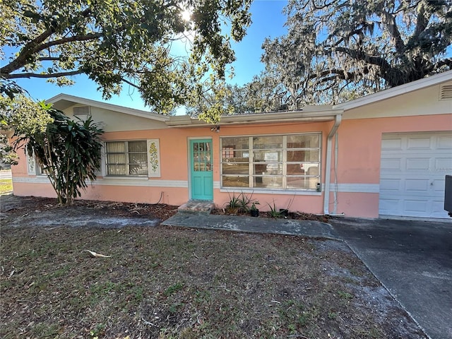 6035 Grand Blvd, New Port Richey, FL 34652 - ranch-style home featuring stucco siding and a garage