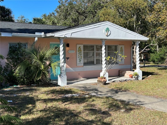 6035 Grand Blvd, New Port Richey, FL 34652 - view of front facade featuring a front lawn and a porch