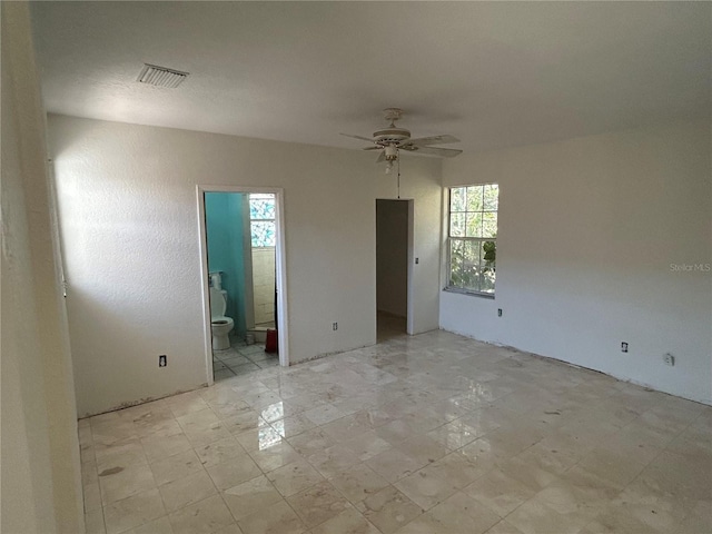 6035 Grand Blvd, New Port Richey, FL 34652 - spare room with plenty of natural light and ceiling fan