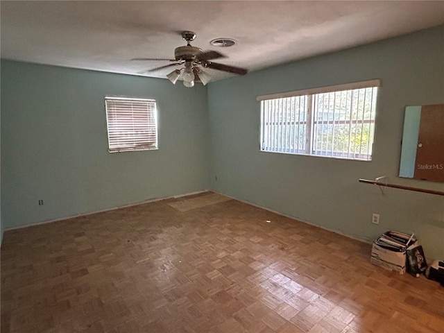 6035 Grand Blvd, New Port Richey, FL 34652 - spare room featuring a ceiling fan and baseboards
