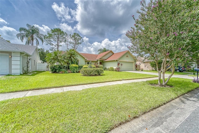 single story home featuring a front yard and a garage