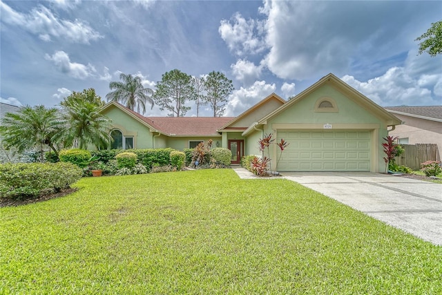 ranch-style house featuring an attached garage, driveway, a front yard, and stucco siding