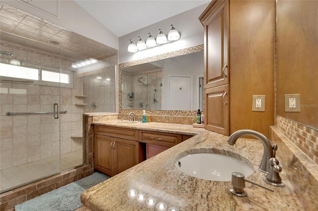 full bath featuring a stall shower and vanity