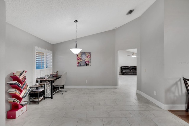 dining room with ceiling fan, baseboards, visible vents, and vaulted ceiling