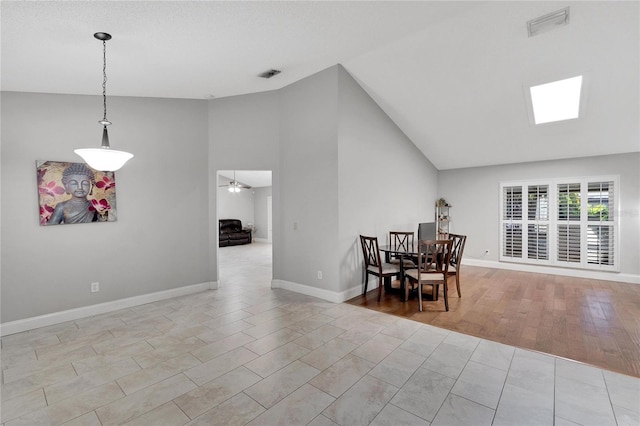 dining room with baseboards, visible vents, and ceiling fan