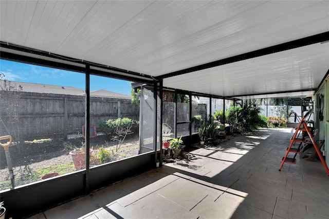 unfurnished sunroom featuring a wealth of natural light