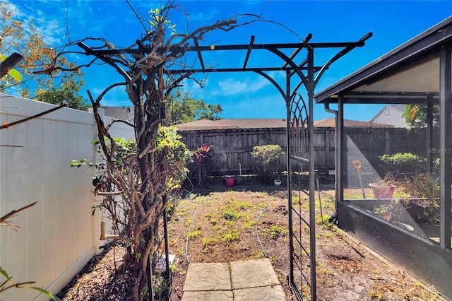 view of yard with a fenced backyard and a vegetable garden