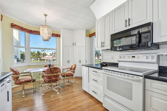 kitchen with hanging light fixtures, light hardwood / wood-style flooring, white range with electric stovetop, crown molding, and white cabinets