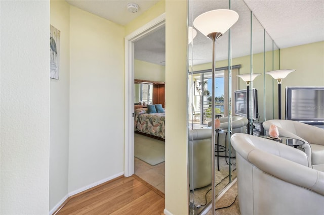 hall with light hardwood / wood-style flooring