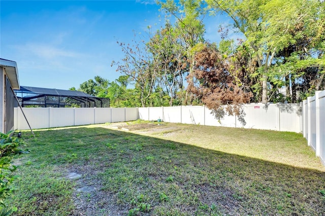 view of yard featuring a lanai