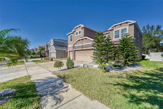 view of front of house featuring a front yard and a garage