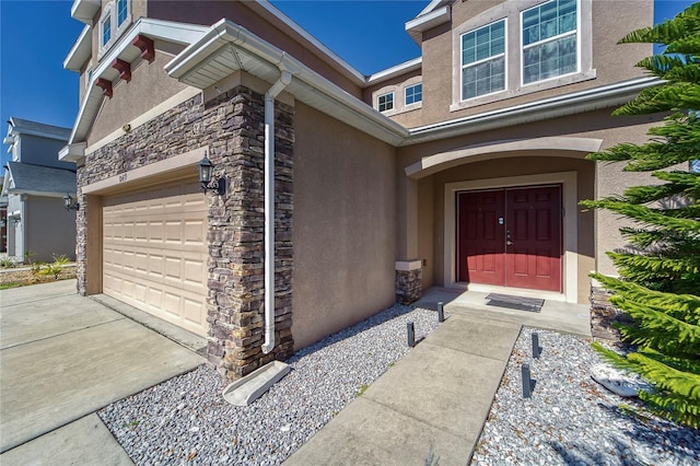 view of exterior entry featuring a garage