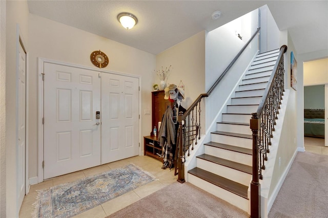 entrance foyer with light tile patterned flooring