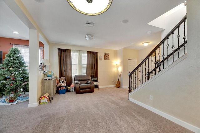 sitting room featuring carpet flooring