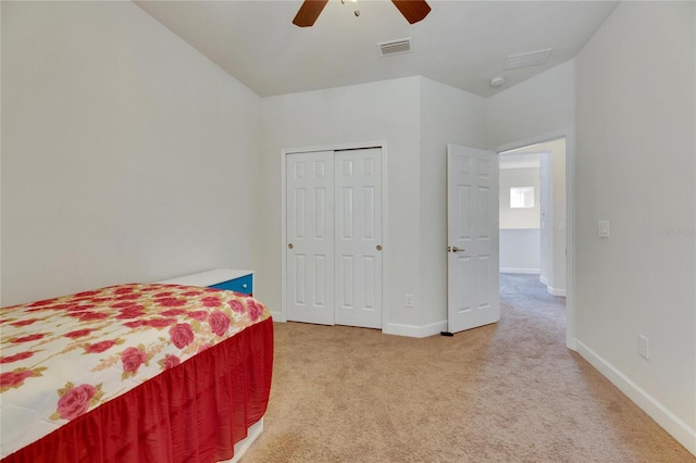 bedroom featuring ceiling fan, a closet, and carpet floors