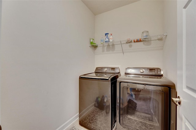 laundry room with washer and clothes dryer