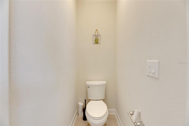 bathroom featuring tile patterned floors and toilet