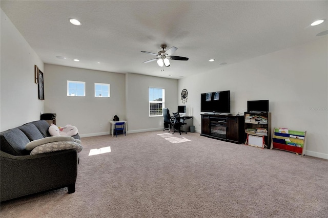 living room with light carpet and ceiling fan