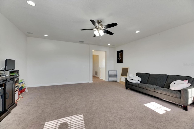 living room featuring ceiling fan and light carpet