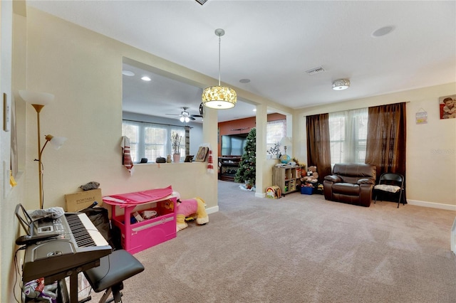 rec room featuring ceiling fan and carpet floors