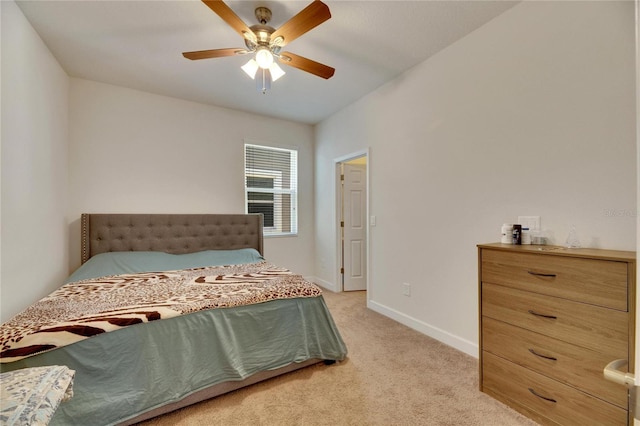 bedroom featuring ceiling fan and light carpet