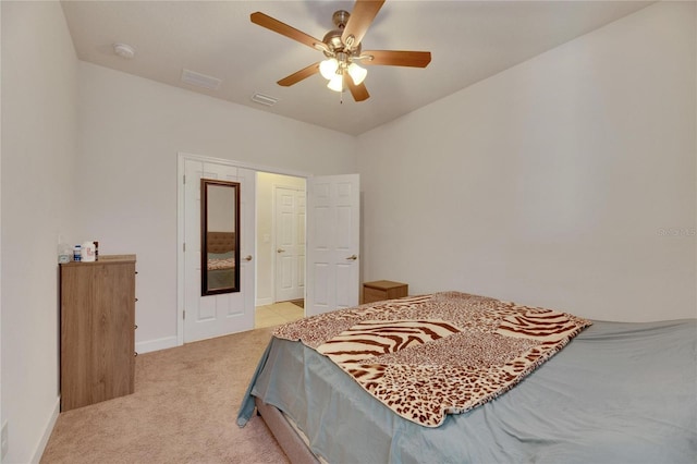 bedroom with light colored carpet and ceiling fan