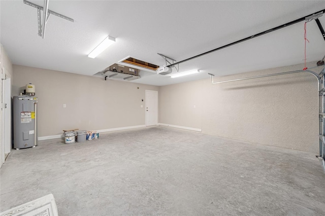 garage with electric water heater and a garage door opener