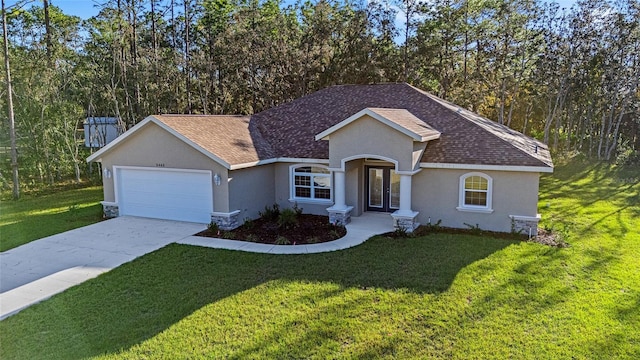 ranch-style house with a garage and a front lawn