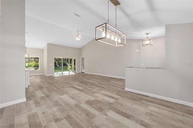 unfurnished living room featuring ceiling fan, light hardwood / wood-style floors, and lofted ceiling