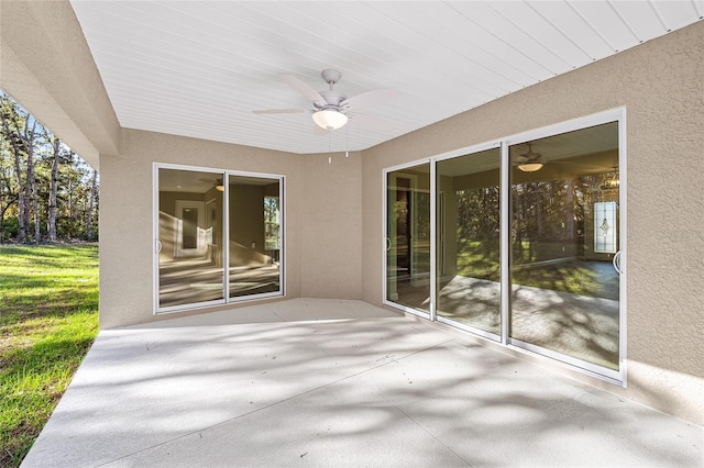 view of patio featuring ceiling fan