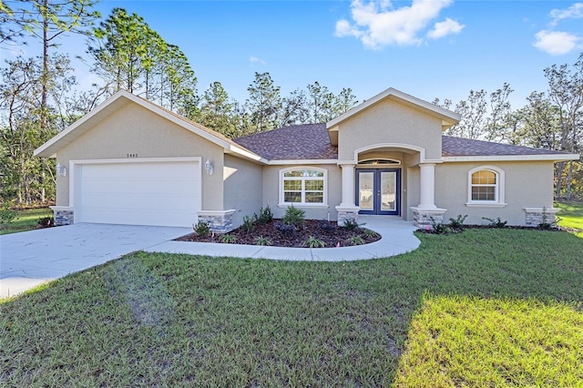 ranch-style home featuring french doors, a front lawn, and a garage