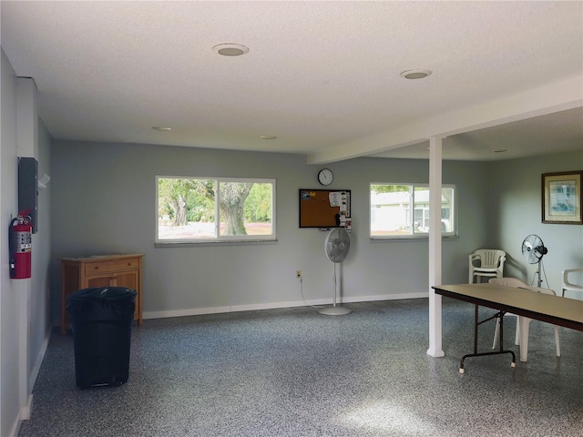 basement featuring a textured ceiling