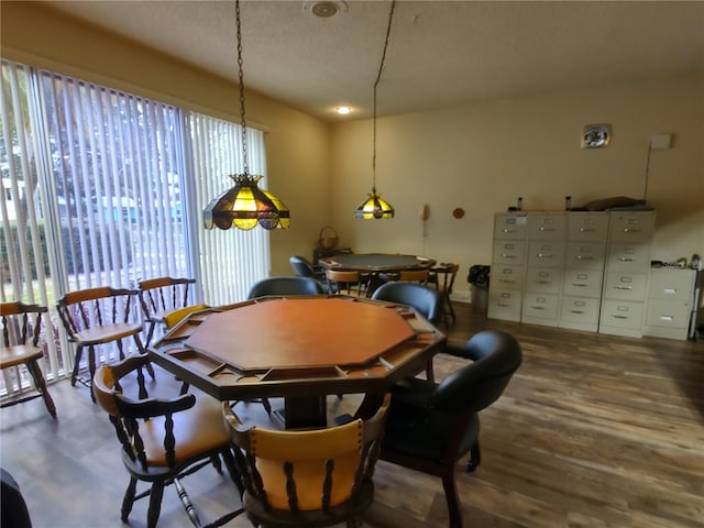 dining room with dark hardwood / wood-style flooring