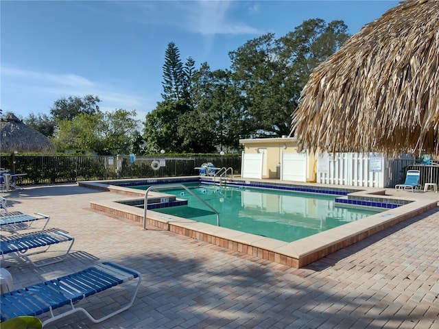 view of swimming pool with a patio