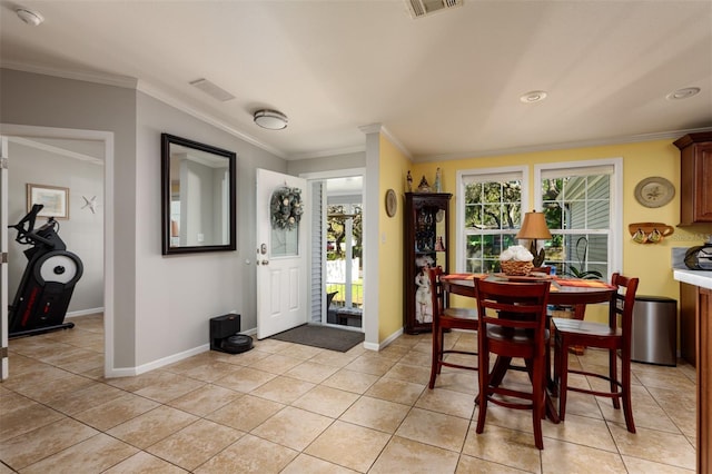 tiled dining room with ornamental molding