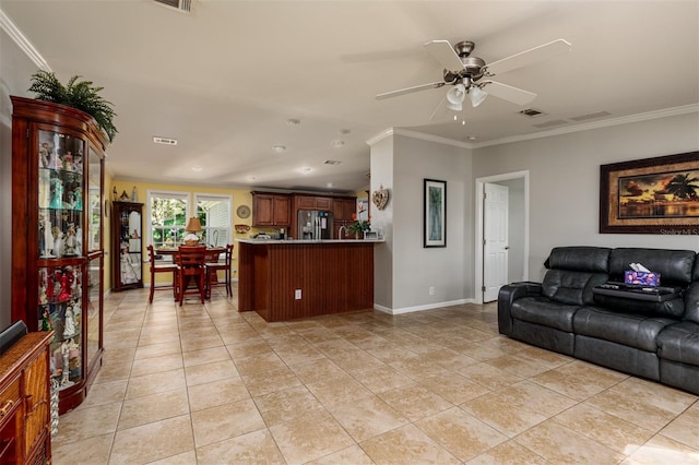 tiled living room featuring ceiling fan and crown molding