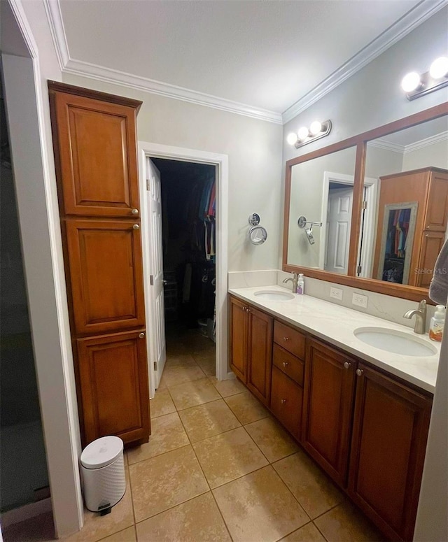 bathroom with tile patterned flooring, vanity, and crown molding