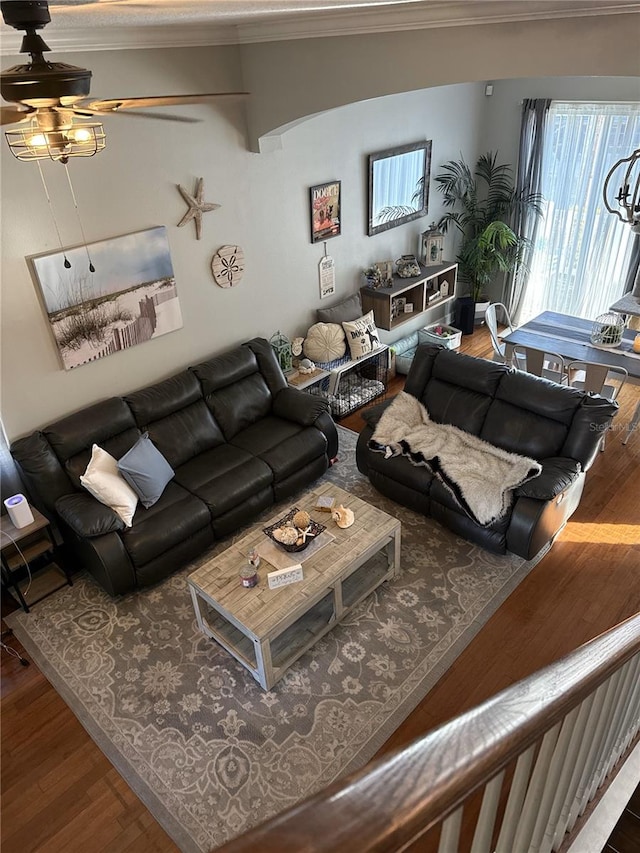 living room featuring crown molding, hardwood / wood-style floors, and ceiling fan