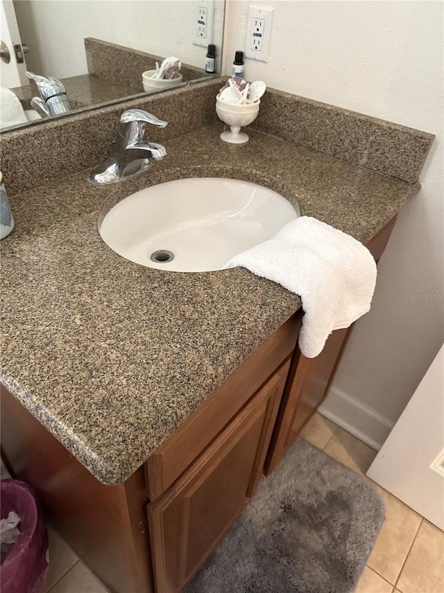 bathroom featuring vanity and tile patterned flooring