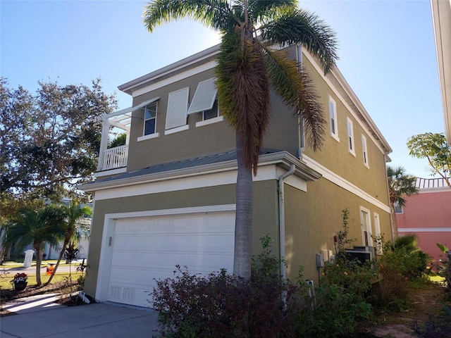 view of property exterior with a garage