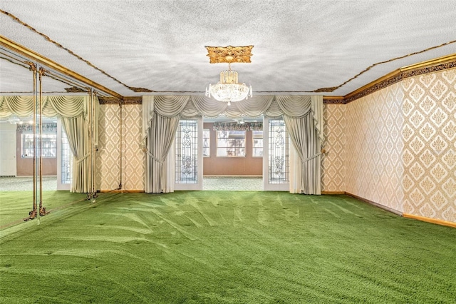 interior space featuring carpet flooring, crown molding, a textured ceiling, and an inviting chandelier