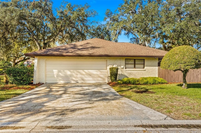 ranch-style house with a front yard and a garage